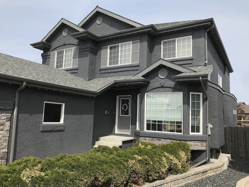 Exterior view of a modern house painted in dark gray